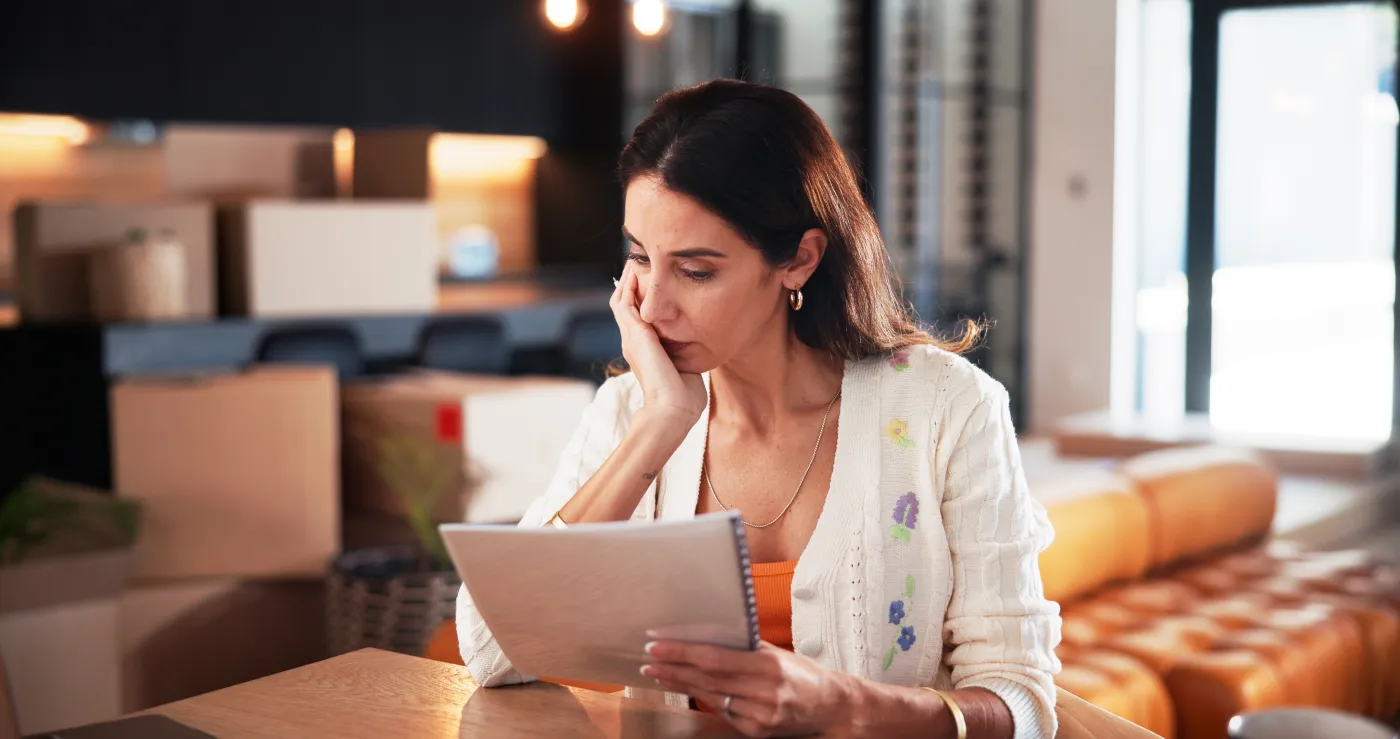 A Florida resident reads paperwork at a table